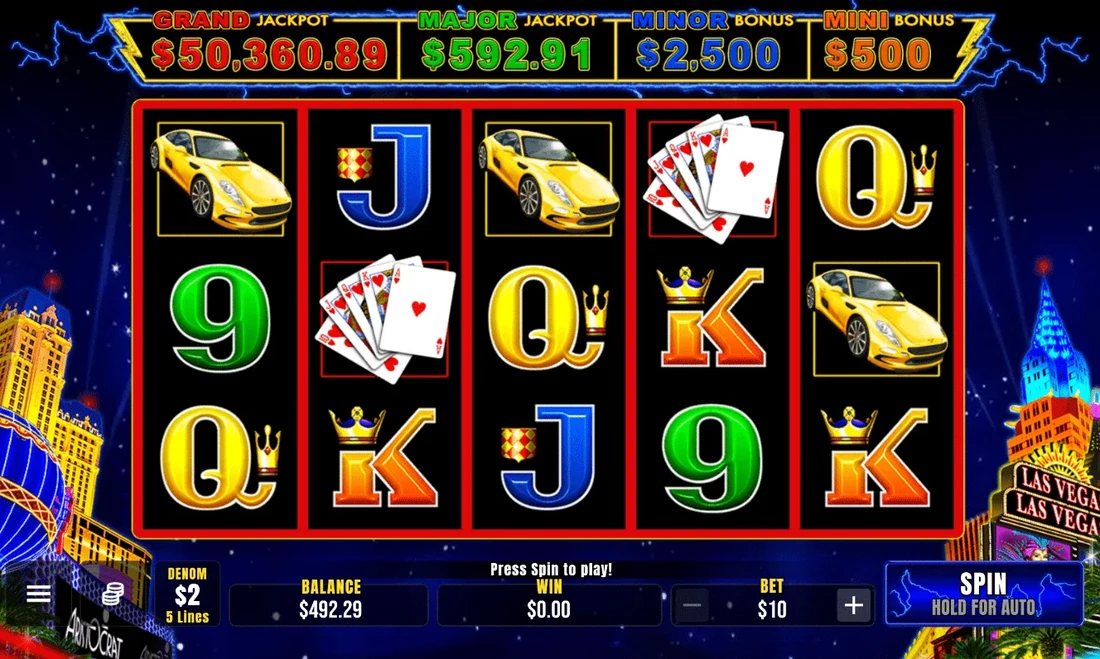 Lightning Link High Stakes on screen: the Grand, Major, Minor and Mini jackpot meters above five reels of cars, cards and royals with a Las Vegas skyline behind